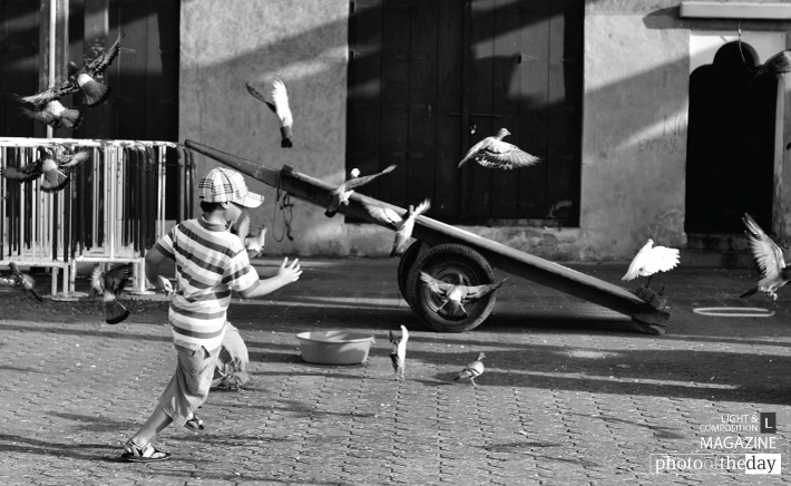 Playtime at the Market, by Jim Alonzo