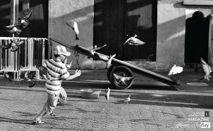 Playtime at the Market, by Jim Alonzo