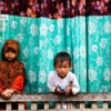 Brother and Sister at the Window by Zain Abdullah - Candid Photography, Photojournalism, Photography Education, Art Photography, Online Photography Courses