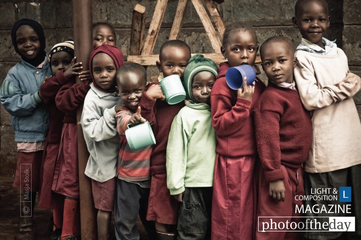 Row of Children Waiting for Porridge, by Masja Stolk - Documentary Photography, Photojournalism,  Masja Stolk,  Photography Awards,  Art Photography