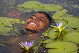 Float like a Lily Flower, by Shahnaz Parvin - Photojournalism, Candid Photography, Documentary Photography, Award-Winning Photography, Photo of the Day