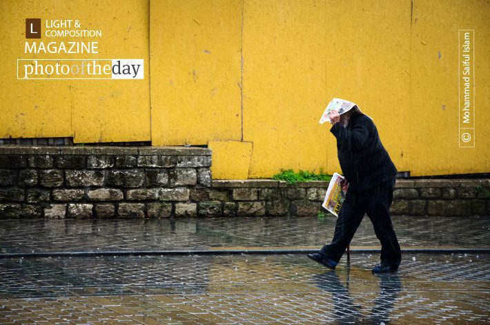 Rhythm in the Rain, by Mohammad Saiful Islam - Street Photography, Photojournalism, Photography Awards, Photo of the Day, Online Photography Courses