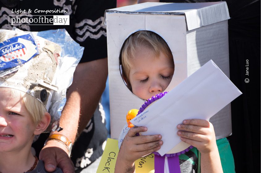 Ah, Got the First Price, by Jana Luo - Photojournalism, Candid Photography, Award Winning Photography, Photography Awards, Photo of the Day