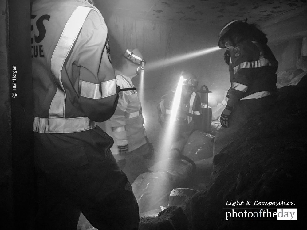 Light in Darkness, by Blair Horgan - Photojournalism, Black and White Photography, Photo of the Day, Award Winning Photography, Photography Education