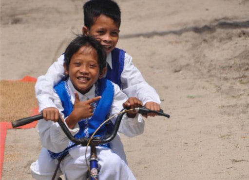 Alimanguan Cycling Boys, by Ryszard Wierzbicki - Travel Photography, Photojournalism, Documentary Photography, Award Winning Photography, Photo of the Day