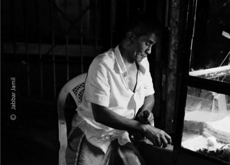 Working at Night, by Jabbar Jamil - Night Photography, Photojournalism, Street Photography, Photography Awards, Black and White Photography