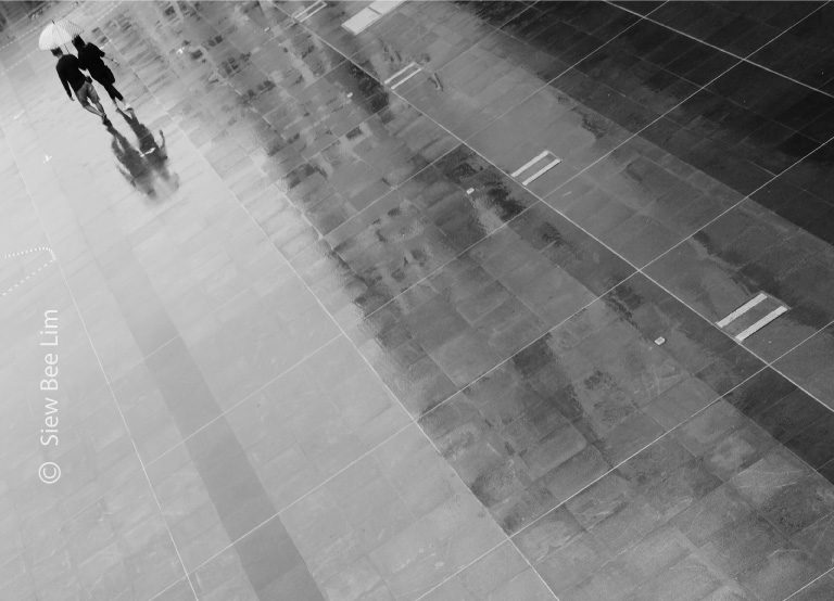 Sharing an Umbrella, by Siew Bee Lim - Minimalist Photography, Photo of the Day, Photography Awards, Online Photography Courses, Art Photography