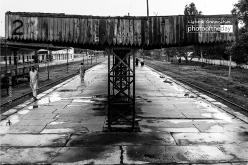 The Walking Platform, by Jabbar Jamil - Street Photography, Black and White Photography, Photojournalism, Photography Awards, Photo of the Day