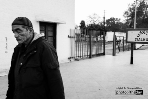 Leaving the Frame, by Jabbar Jamil - Street Photography, Black and White Photography, Photojournalism, Photography Awards, Photo of the Day