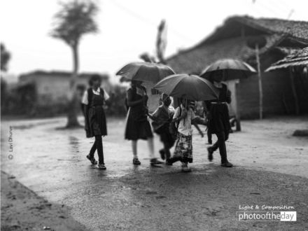 School Kids in the Rain by Lavi Dhurve - Photojournalism, Black and White Photography, Documentary Photography, Award Winning Photography, Photography Education