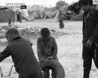 Running Wheel, by Jabbar Jamil - Street Photography, Photojournalism, Award Winning Photography, Jabbar Jamil, Photo of the Day