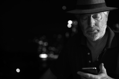 A Man and His Phone by Leanne Lindsay - Street Photography, Black and White Photography, Photo of the Day, Leanne Lindsay, Photography Awards