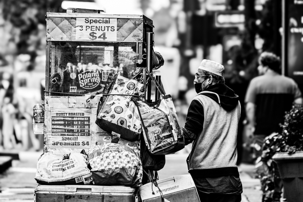 Street Photography, Photojournalism, Documentary Photography, Time Square, Photography Awards - A Street Vendor in the Time Square by Jose Juniel Rivera-Negron A Street Vendor in the Time Square by Jose Juniel Rivera-Negron - Street Photography, Photojournalism, Documentary Photography, Time Square, Photography Awards