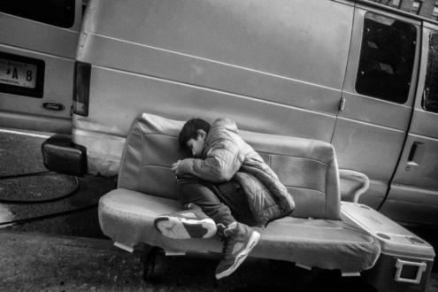 Boy On Car Seat by Keith Goldstein - Photojournalism, Photography, Black and White Photography, Keith Goldstein, Photo of the Day