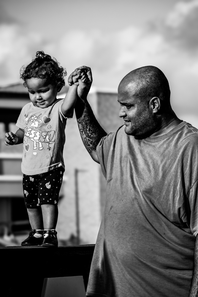 Like Father Like Daughter by Jose Juniel Rivera-Negron - Art Photography, Father Daughter Photo, Black and White Photography, Photojournalism, Photography Awards
