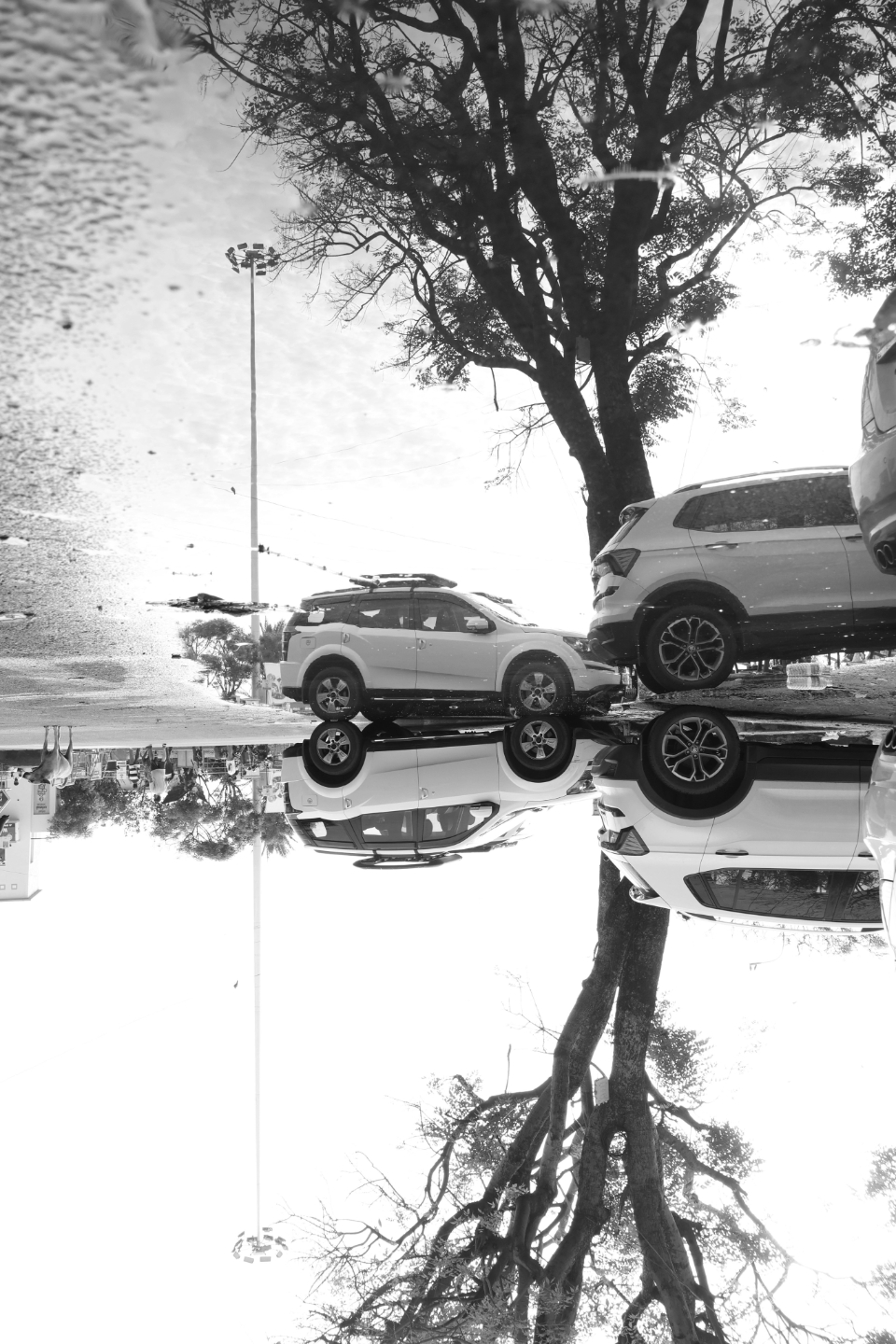 Street Water Reflect as Mirror by Karthick Saravanan - Street Photography, Reflective Photography, Photo of the Day, Art Photography, Photography Education