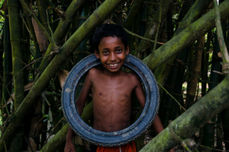 Tyre Boy by Arif Hossain Sayeed - Photojournalism, Art Photography, Photography Awards, Photo of the Day, Arif Hossain Sayeed