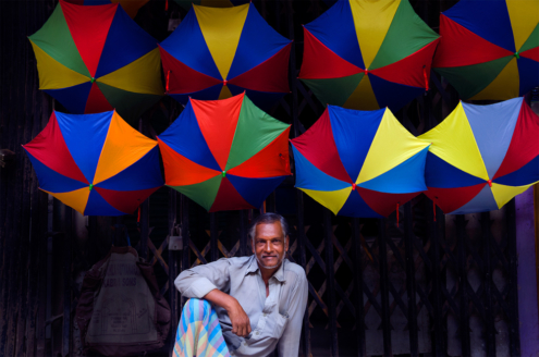 Umbrella Vendor by Arif Hossain Sayeed - Photojournalism, Documentary Photography, Photography Awards, Photo of the Day, Arif Hossain Sayeed