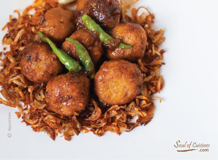 Rohu fish curry on top of steamed rice Bengali Fish Kofta Curry with Onion Gravy