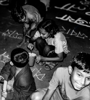Children Writing on the Pavement at Night