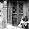 A Man Seated at the Temple Door - Fine Art Photography Prints, Photography Composition Guide, Visual Storytelling Photography, Contemplative Photography Art, Documentary Photography Prints