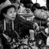 Market Vendor with Woven Hat and Pumpkins - Black and white photography, documentary photography, portrait photography, fine art photography, Nasrul