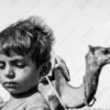 Desert Reverie: Boy and Camel - Fine Art Photography Print, Limited Edition Photography, Luxury Photography Art, Museum-Quality Photography, Art Photography Collectors