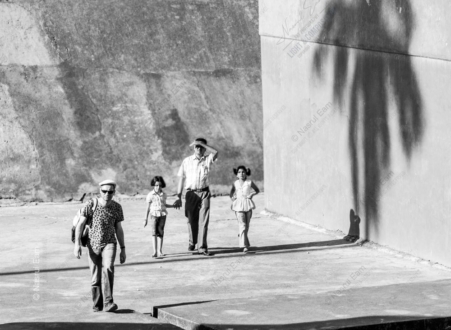 Four Figures and a Wall of Shadow