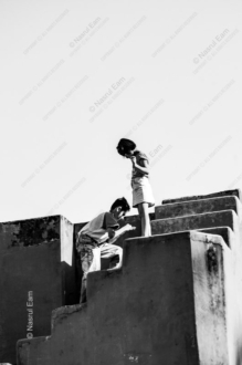 Two Children on the Concrete Steps
