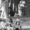 Children Waiting by a Brick Wall
