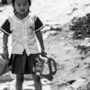 Young Girl with Water Canisters