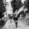 Porters on a Winding Mountain Trail