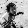 A Child Crouching in the Dust - Fine Art Photography Print, Limited Edition Photography, Black and White Portrait, Giclée Print,  Child Portrait