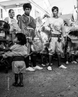 Festival Performers and a Child in the Street - Fine Art Photography Print, Limited Edition Photography, Giclée Print, Monochrome Photography,  Art Photography