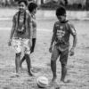 Boys with a Soccer Ball on a Worn Field - Fine Art Photography Print, Limited Edition Photography, Monochrome Photography, Childhood Photography, Art Photography for Sale
