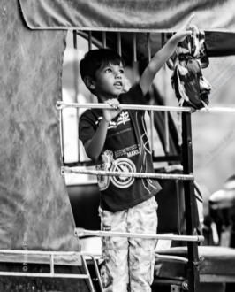 Boy in a Rickshaw, Pointing - Fine Art Photography Print, Limited Edition Photography, Museum-Quality Photography, Photography Art Investment, Monochrome Photography