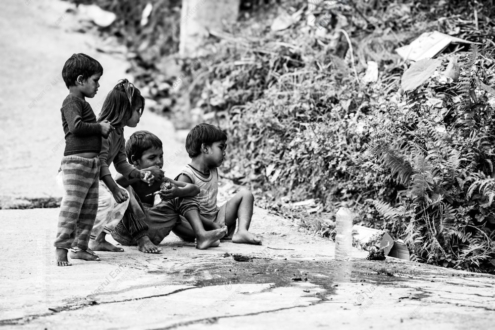 Barefoot Children by the Roadside, Absorbed in the Moment