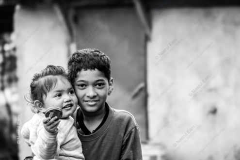 Sibling Embrace, Curious Gaze