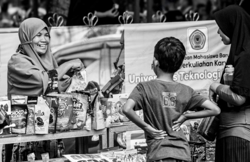 A Shared Smile at the Market Stall