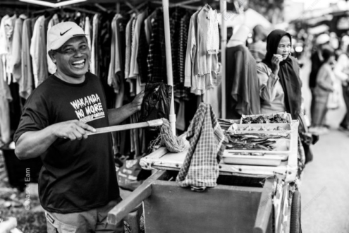 The Laughing Man at the Market Stall - Fine Art Photography Print, Limited Edition Photography, Black and White Photography, Documentary Photography,  Art Photography for Sale