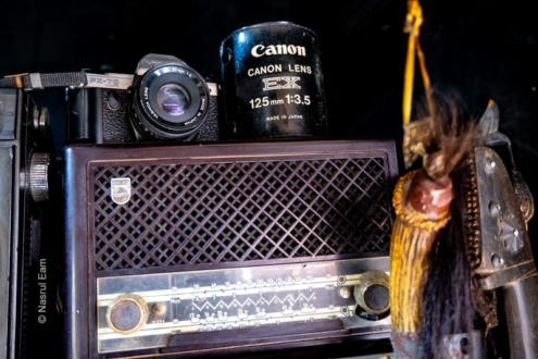Camera and Lens on a Vintage Radio