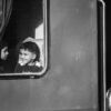 Children at the Train Window - Children train window photography, visual storytelling photography, photo composition light study, emotional connection photography, black and white photography guide, contemporary photography journals