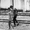 Two Boys on the Railway Line - documentary photography, fine art photography, visual storytelling, photography books, photo composition, narrative photography