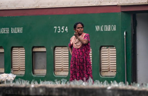 Woman at the Railway Wall - photography portrait, visual storytelling photography, photography composition, environmental portraiture, photography education, contemporary photography