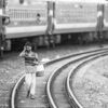 The Water Carrier on the Railway Line - visual storytelling photography, monochrome photography, photography masterclass, documentary photography, fine art prints, photography composition