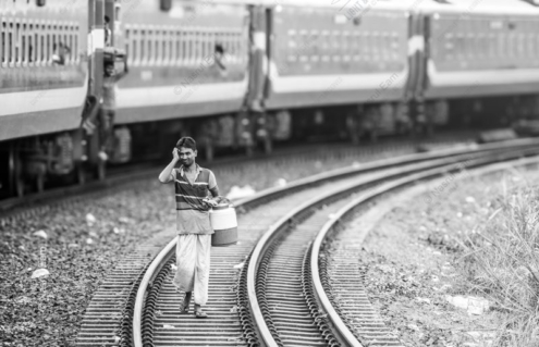 The Water Carrier on the Railway Line - visual storytelling photography, monochrome photography, photography masterclass, documentary photography, fine art prints, photography composition
