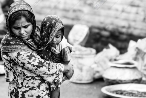 A Woman Holding Her Child