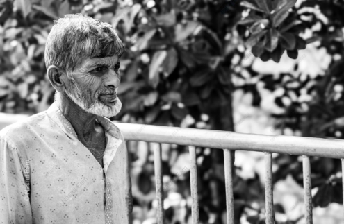 An Elder by the Railing