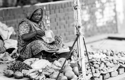 A Woman Among Her Roadside Wares
