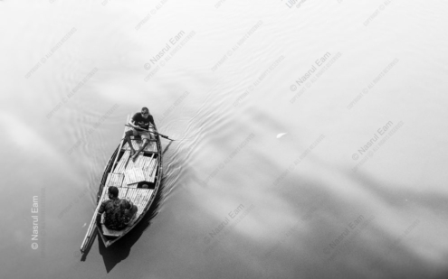 Two Men in a Boat on Luminous Water